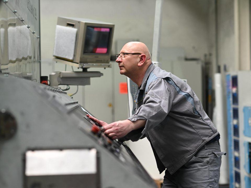 male worker using machinery