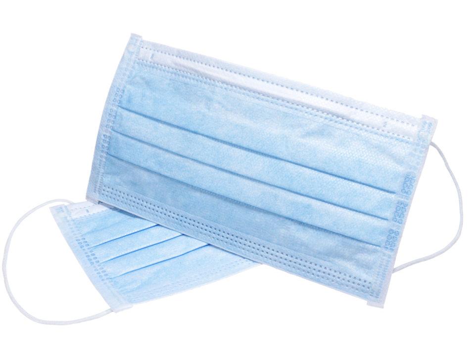 Medical protective face masks on white surface